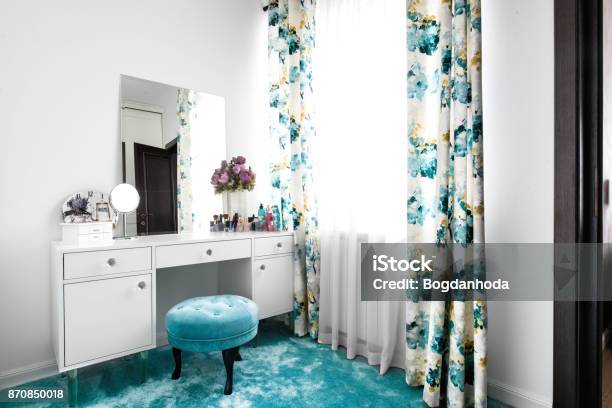 Cozy And Modern Feminine White Dressing Room With Minimalist Vanity Table And Mirror Stock Photo - Download Image Now