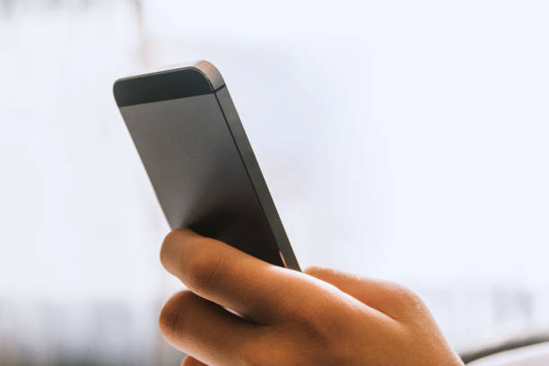 istock Close up of a man using mobile smart phone 870855812