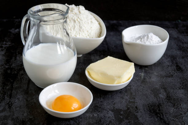 istock Ingredients for buns on a black background. 870856886