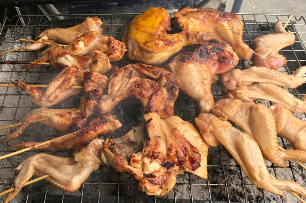 istock Grilled chicken on charcoal stove 870857158