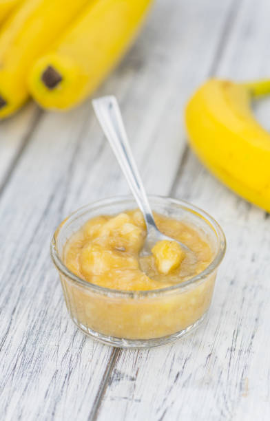 istock Banana Puree on wooden background 870857222