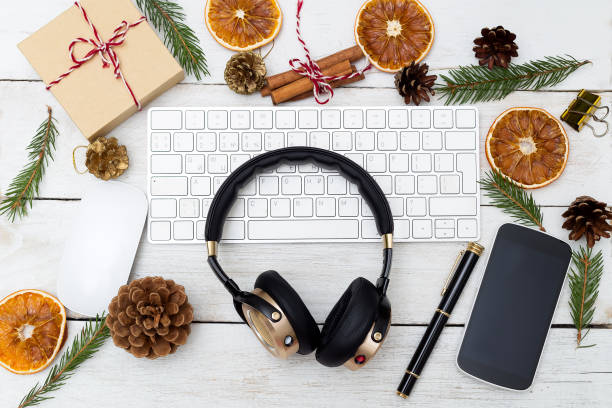 istock New Year's workplace with headphones and Christmas decorations. Flat lay 870864146