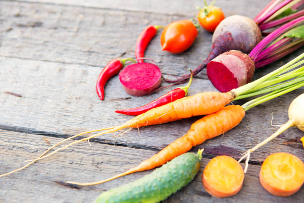 istock Vegetables on wood. Composition of fresh vegetables on a wooden table 870864228