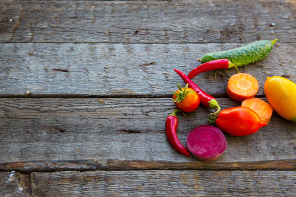istock Vegetables on wood. Composition of fresh vegetables on a wooden table 870864330