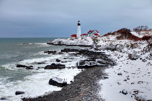 Portland Head Lighthouse is a historic lighthouse in Cape Elizabeth, Maine. The light station is automated, and the tower, beacon, and foghorn are maintained by the United States Coast Guard. The light station sits on a head of land at the entrance of the primary shipping channel into Portland Harbor, which is within Casco Bay in the Gulf of Maine.