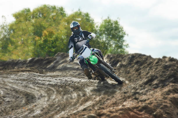 istock Motocross driver on race track 870871076