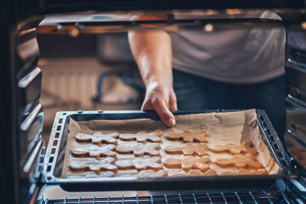 istock Baking Gingerbread Cookies in the Oven 870875124