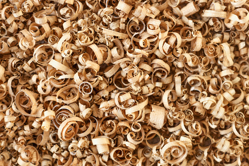 Wooden shavings background pattern textur. Top view. Close up