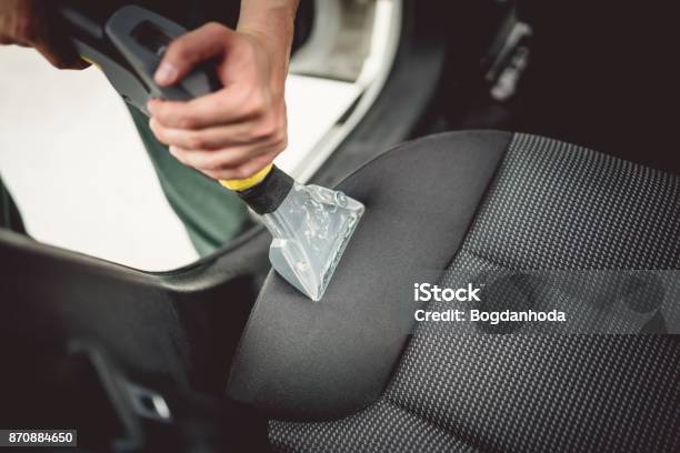 Close Up Details Of Worker Vacuuming Leather Car Interior Stock Photo - Download Image Now