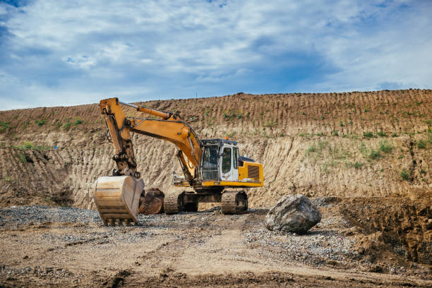 istock engineer working with excavator and loading gravel, soil and earth 870887700