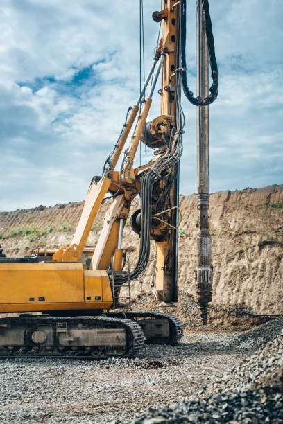 istock drilling rig machinery on highway construction site. Viaduct construction and bridge pillar details 870887758