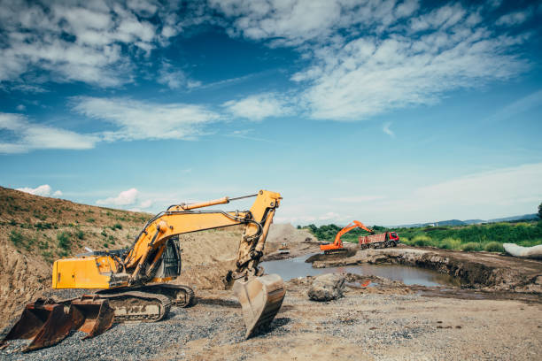 istock Highway construction site building details with excavators loading dumper trucks, bulldozer, scoop working and engineers 870887846