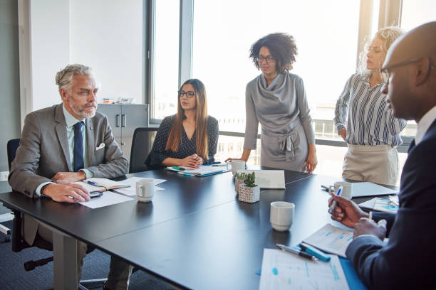 istock Diverse office colleagues having a meeting together in a boardroom 870891040