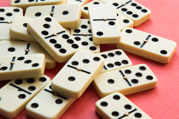 istock Group of Dominoes on Pink 870894310