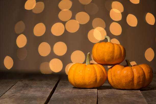 istock acorns pumpkin oak leaf lighted background 870894760
