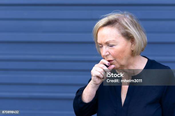 Unwell Elderly Lady Having A Coughing Fit Stock Photo - Download Image Now - Choking, Coughing, Adult