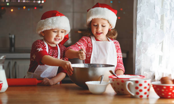 istock happy children bake christmas cookies 870898736