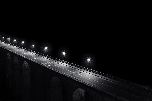 A city bridge illuminated at night