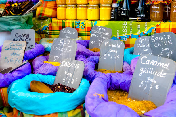Market stall with several flavored spices bags with price tags, Sainte Anne, Guadeloupe