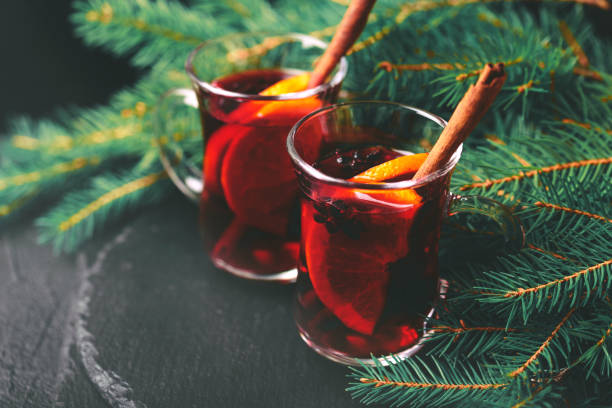 istock Hot mulled wine. Christmas tree branches and cones. Holidays. 870905754