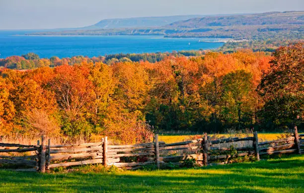 Autumn landscape of Niagara Escarpment and Georgian Bay, with Blue Mountain ski slopes, Collingwood and Meaford Marina in the background