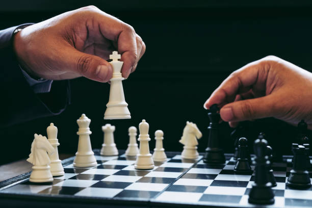 istock Close up of hands confident business man colleagues playing chess game to development analysis new stragy plan. 870907826
