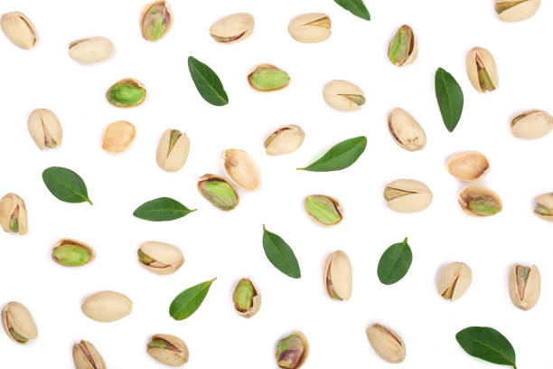 istock Pistachios with leaves isolated on white background, top view. Flat lay pattern 870908858