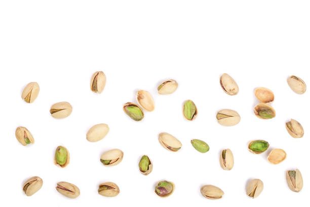 istock Pistachios isolated on white background with copy space for your text, top view. Flat lay pattern 870908964