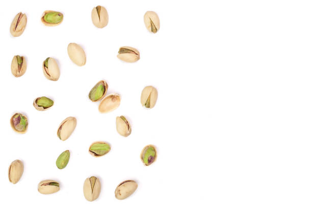 istock Pistachios isolated on white background with copy space for your text, top view. Flat lay pattern 870909014