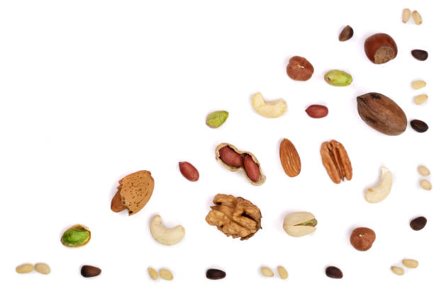 istock mix of different nuts isolated on white background with copy space for your text. Flat lay pattern. Top view 870909202