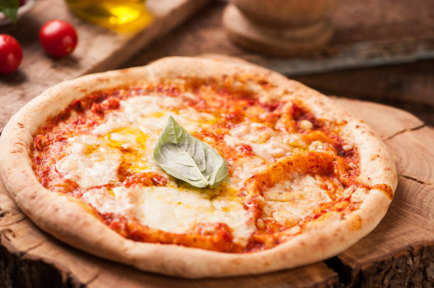 istock Margherita Italian Pizza on wooden table 870915562