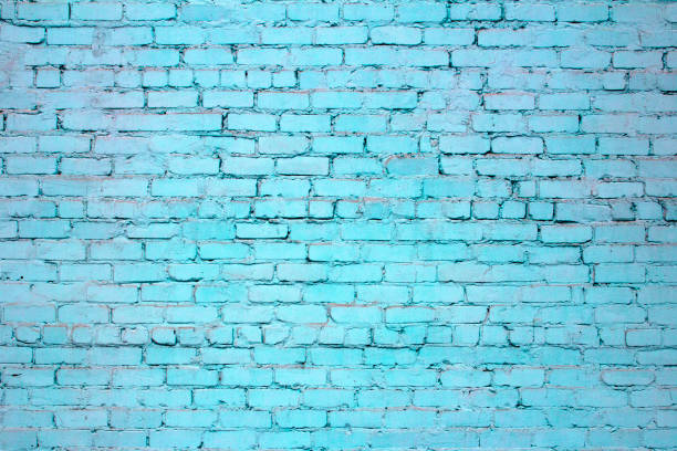 istock Brick wall. The brick wall painted in blue 870915902