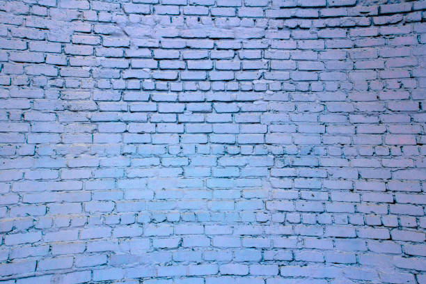 istock Brick wall. The brick wall painted in blue 870915908