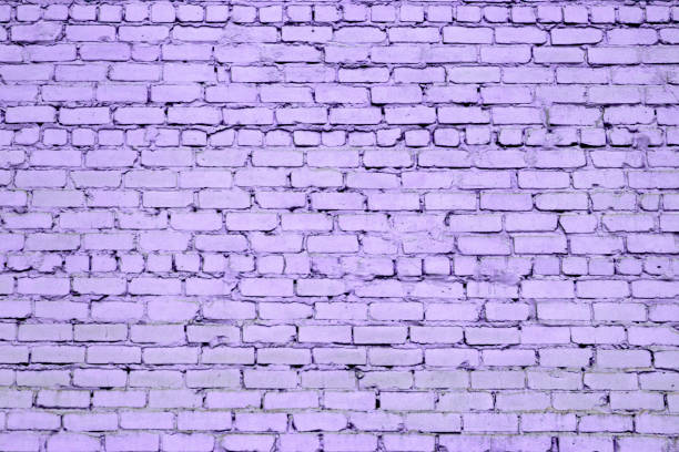 istock Brick wall. The brick wall painted in blue 870915930