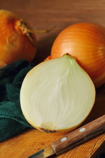 istock Heads of raw yellow onions 870916154