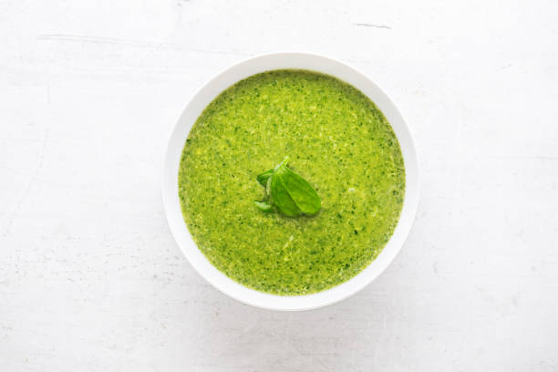 istock Spinach soup with green leaves in white plate 870918614