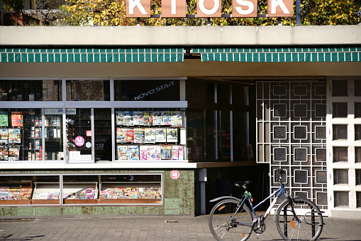 Griesheim, Germany - October 31, 2017: A bicycle parked in front of an old kiosk and newspaper sale on October 31, 2017 in Griesheim.