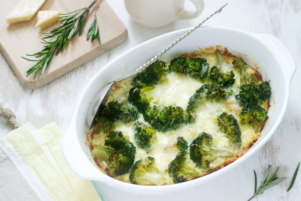 casserole with broccoli, cauliflower and cheese on a light background. - cauliflower vegetable portion cabbage imagens e fotografias de stock