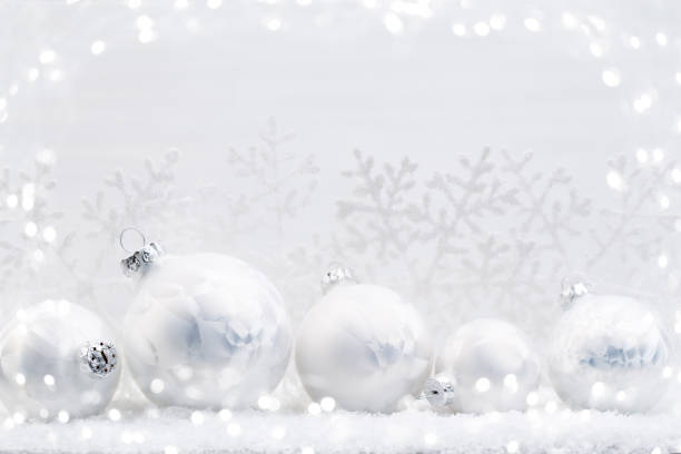 istock Silver Christmas balls on shiny background. 870937802
