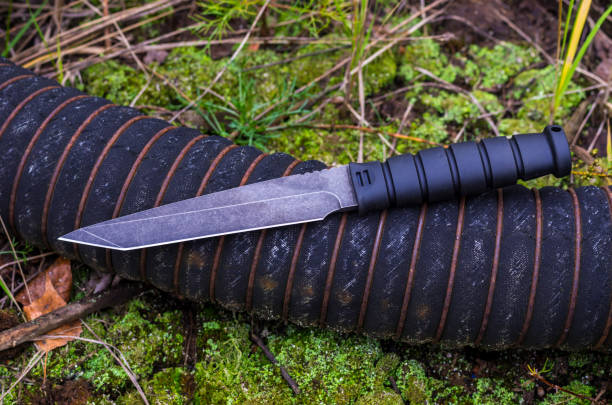 istock A large military knife for the performance of combat missions. Fall. 870944108