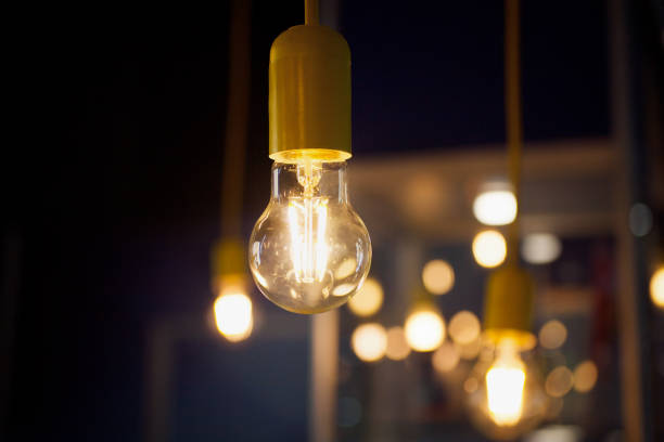 istock light bulb close-up with lights on the background 870951216