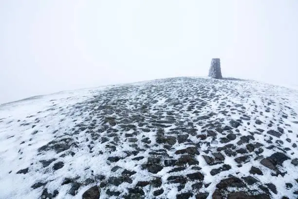 Triangulation station on the summit of Mam Tor in Winter. Peak District, Derbyshire, UK
