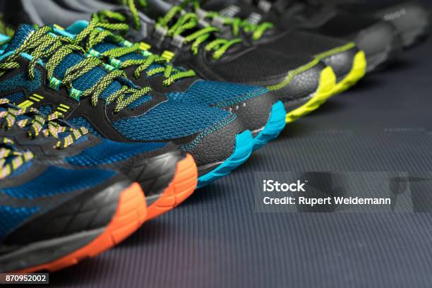 Four Pairs Of Running Shoes Stock Photo - Download Image Now - Store, Shopping, Sports Shoe