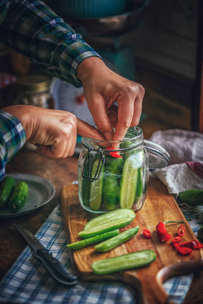 istock Preserving Organic Cucumbers in Jars 870952348