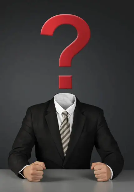 Photo of Businessman without head with question mark on dark