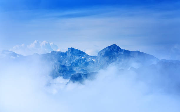 Swiss Alps peeking through the clouds