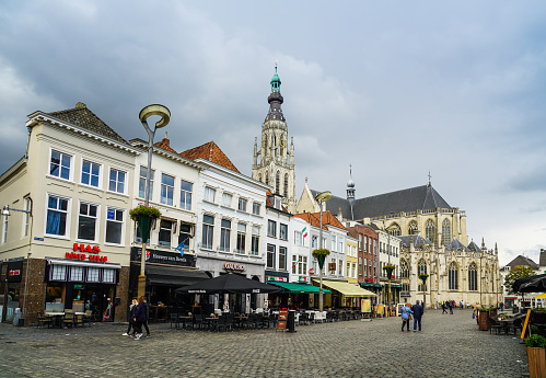 Breda, November 5th 2017: some locals walking in a shopping street near the old church in the center