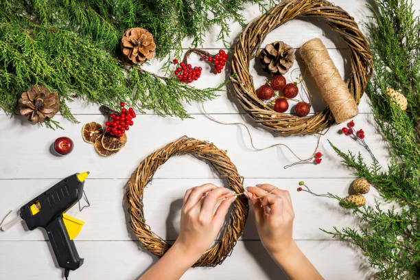 Christmas wreath decoration with handmade DIY, do it by yourself Christmas wreath decoration with handmade DIY, do it by yourself. Top view. Copy space. Flat lay. Still life. wreathed hornbill stock pictures, royalty-free photos & images