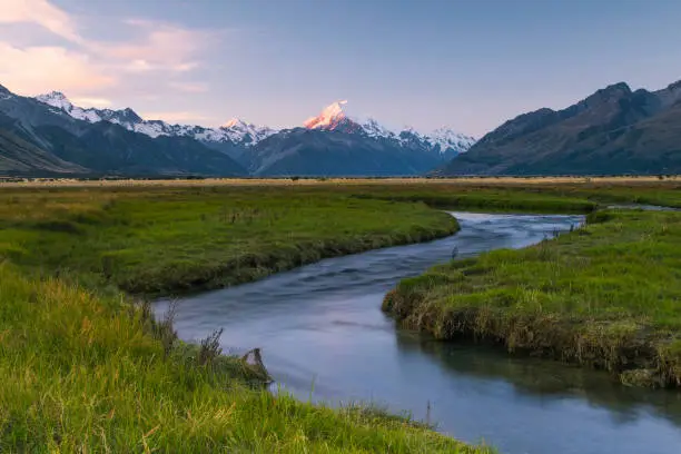 Sunset at Glentanner river flats hitting the magnificent Mt. Cook in New Zealand.