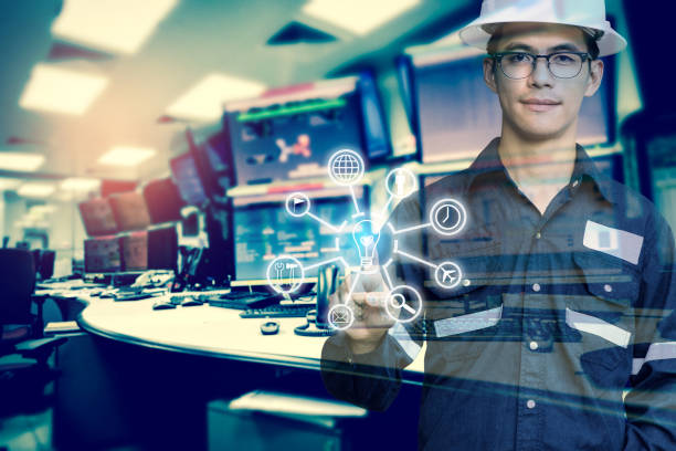 istock Double exposure of Engineer or Technician man with business industrial tool icons while pointing finger with monitor of computers room for oil and gas industrial business concept. 870968600